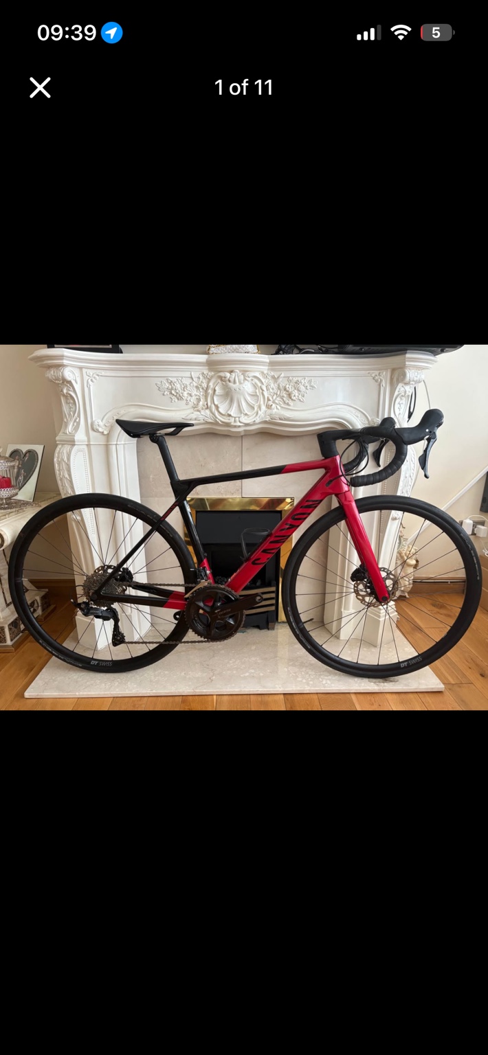 Red and black Canyon CF SL 7.0 road bike, drive-side view