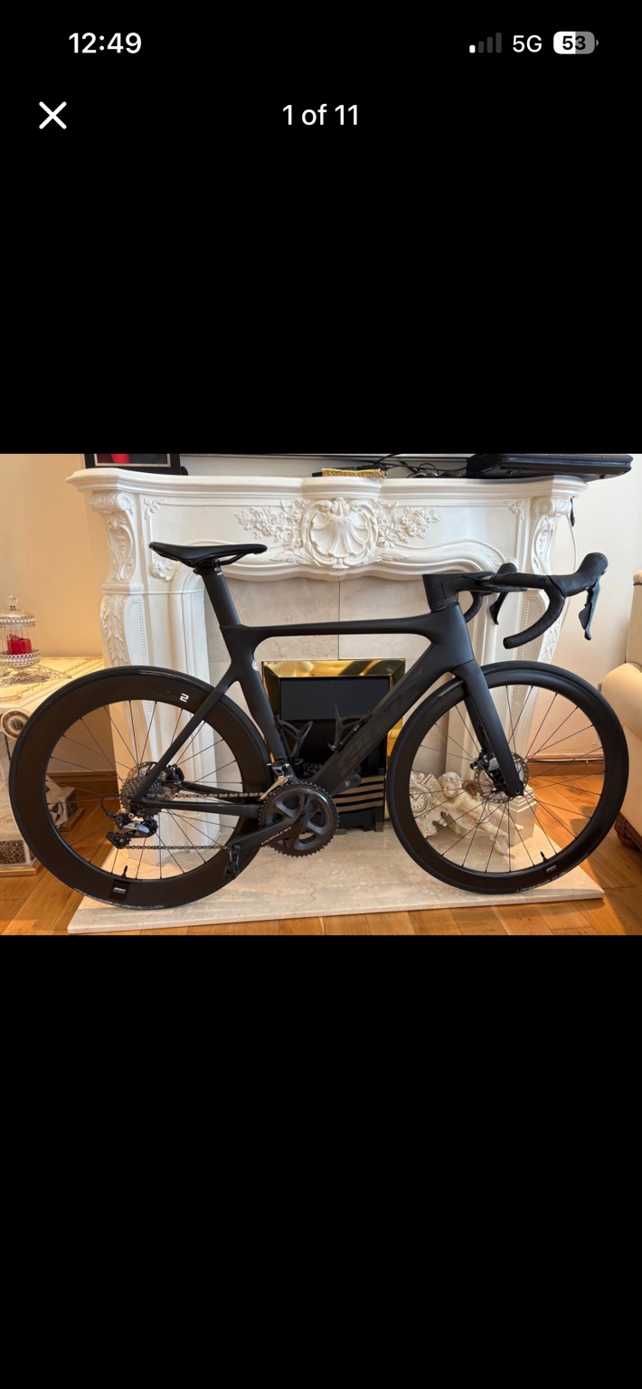 Black Giant Propel Advanced Pro road bike with carbon wheels, drive-side view